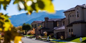 Row of houses on a street with the Sandias in the background