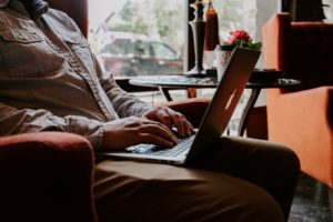 Man typing on a laptop